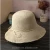 Import Fashion summer paper hats foldable straw hat summer beach straw hat women from China
