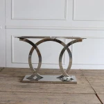 shiny stainless steel base with brown color console wooden table top