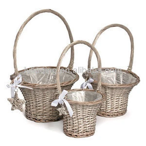 wicker/willow girl flower/gift basket with handle a star and plastic liner