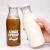 Import 200ml 250ml 500ml 1000ml customized round glass milk bottle with metal cap from China