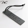 China Custom Black Pu Leather Label Hang Tag For Jeans Bags Shoes
