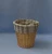 Import Household hot sale wastebasket split willow wicker round waste storage basket in honey color with stripe liner from China