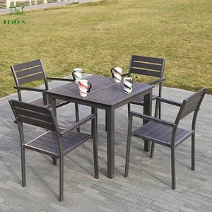 Outdoor furniture set of plastic wood dining chairs and tables