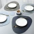 Import PVC leather irregular place mat settings heat resistant luxury dining table placemat from China
