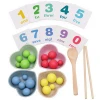 Children practice using chopsticks to hold beads Zi mathematical enlightenment toys
