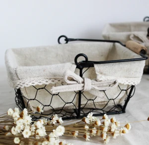 oval shaped metal wire basket with wooden handles and liners