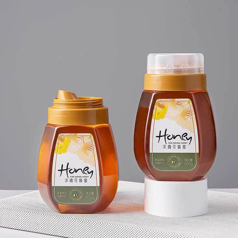Wholesale Plastic Honey bottle with Caps Reflux Honey Jar Transparent Food 300g 500G 1000G Plastic Cylindrical Food Bottles