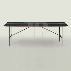 Dining table with powder coated steel base and center walnut swell pattern