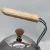 Import New style household stainless steel whistling tea kettle with wooden handle from China