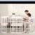 Import Hot sale  multifunctional pine wood round baby crib bed from China