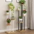 Import Modern 4 tier metal plant shelf black multi tiered rod iron plants stands from China