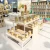 Import SHIJIE newborn baby shopping display stand wooden customized kids clothes groceries store display racks from China