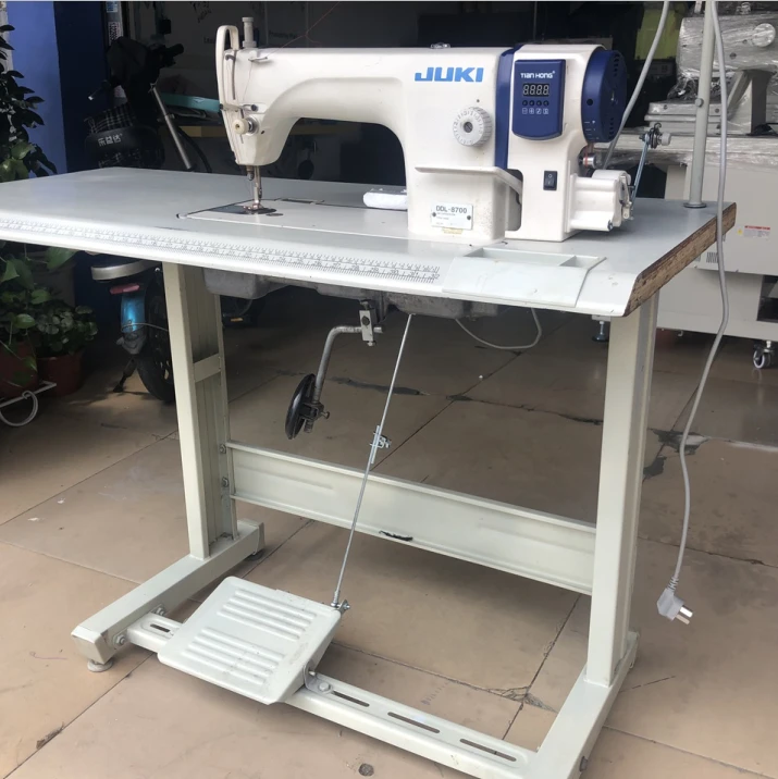 used juki8700l Sewing machine with table.