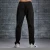 Import 2020 OEM unisex blank gym causal tracking pants leisure sports running cuffed sweat trousers from China