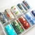 Import 4CM*500M Free sample nail products wholesale brand logo half clear nail art foil decal sticker from China