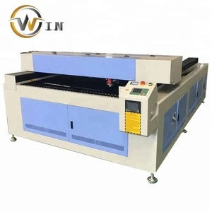 Jinan owin cnc 1325 CO2 metal laser cutting machine cutting 2mm stainless steel for sale