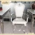 Import new design modern silver stainless steel dining table and chair sets from China