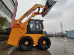 Chinese skid steer loader used in small construction projects with towable backhoe