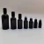 Import Hengjian 5ml 10ml 15ml 20ml 30ml 50ml 100ml shiny black glass roller bottle roll on ball essential oil perfume bottle with cap from China