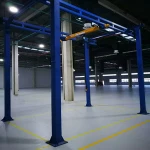 Self-erecting free standing bridge crane
