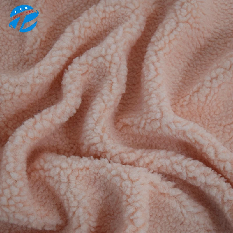 Spot direct selling of whole polyester lamb cashmere autumn and winter warm coat hat clothing grain fleece fabric manufacturers