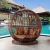 Import Yizhou Indoor club hotel garden wicker solarium tanning sunbed rattan apple shape sun bed rattan outdoor cage round bed from China
