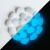 Import Colorful decorative luminous pebble gravel glow in the dark resin stone from China