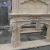 Import European style carved natural travertine indoor marble fireplace surround / beige stone fireplace for sale from China