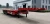 Import Goose neck Trailer 3 axle 40 ft flat half low bed loader hook board transport trailer for sale from China