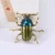 Import Popular Insect Brooch Simple Environmental Alloy Drop Oil Gold Beetle Brooch Metal Paint Insect Brooch from China