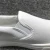 Import Unisex Women Men Plain White Canvas Slip-on Shoes Flat Wholesale from China