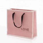 Wholesale Custom Logo Pink Luxury Kraft Gift Takeaway Cloths Shopping Paper Bag With Handle