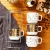 Import wholesale porcelain stackable espresso coffee cup set with mental stand stacking demitasse ceramic mug from China