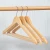 Import Anti-theft Elegant Wooden Top Hangers in Dark Brown Finish with Metal Rail/Clips for Hotel Suits/Shirts/Dress from China
