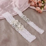 Beautiful lace wedding garter made by pearls and rhinestones