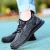 Import black colored anti smash anti stab fly rubber sole knit industrial shoes for men and woman from China