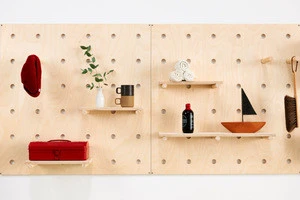 Decorative wall-mounted wood board for moveable shelves and pegs