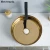 luxurious artistic round shape gold color countertop ceramic body bathroom sinks electroplate process washbasin