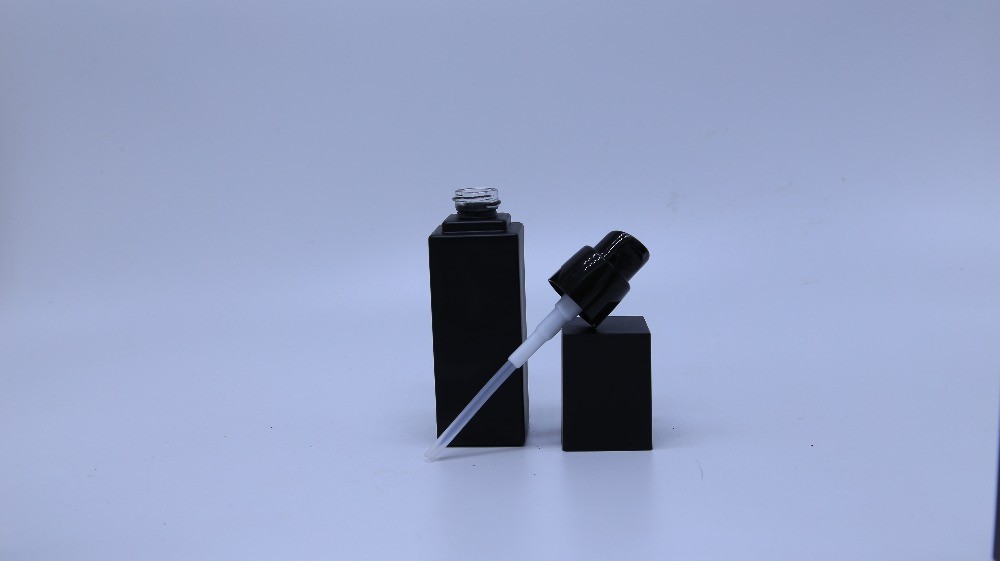 Frosted black glass bottle with pump for cosmetic