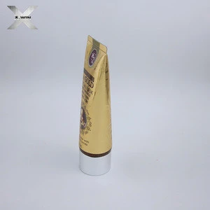 gold color round shape plastic cosmetic tube