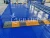 Import mid rise with hydraulic flat for low vehicles mini small 19ft 4000kg auto 10m large scissor lift from China