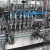 Import new condition automatic filling liquid machine with low price from China