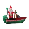 Santa claus standing in inflatable boat for Christmas yard decoration