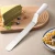 Import Hot Sales Stainless Steel PP Plastic Handle Spatula Cake Cream Curved Spatula With Measuring Scale from China