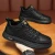 Import New breathable and waterproof mens shoes versatile black leather shoes mens sports and leisure board shoes from China