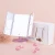 Import Desktop foldable makeup mirror with LED lights and sensor Travel Makeup Mirror Lighted LED Mirror from China