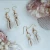 Import Gold jewelry natural shell huggie hoop earrings from China