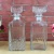 Import OSHOW Wholesale 500ml 1000ml Luxury Clear Whiskey Vodka Decanter Tequila Glass Bottles With Lid from China