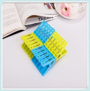 Colorful small plastic clothes pegs