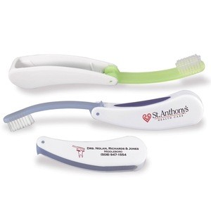 Fold Away Toothbrush - ergonomically designed handle features a rubber grip for easy brushing with medium nylon bristles